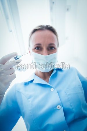 tandlæge i kirurgisk maske injektion - Royalty Free Image #15496129 | PantherMedia Billedbureau